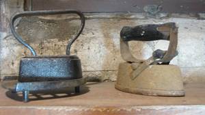 (2) antique sad irons, one of which...