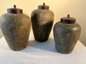 3 decorative ceramic vessels with metal lids