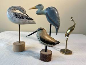 4 bird figurines on stands