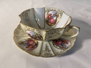 delicate scalloped tea cup and saucer