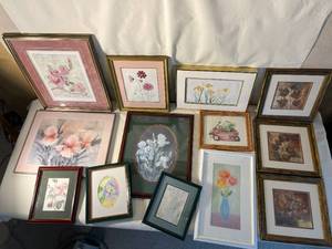 lot of floral art in frames