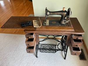 antique Franklin Sewing Machine in cabinet w attachments