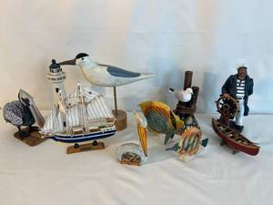 collection of nautical decor   birds, lighthouse, sea captain and more