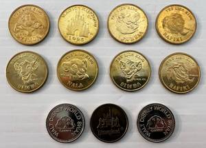 lot 61 image: Vintage Disneyland Locker Tokens