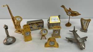 lot 107 image: Group Of Vintage Miniature Figural Clocks
