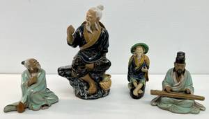 lot 127 image: Group Of Oriental Mudman Statues