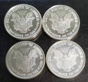 1 TROY OZ .999 FINE SILVER 4 X � OZ WALKING LIB DESIGN