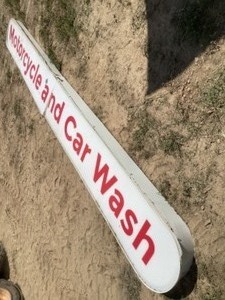 lot 61 image: Motorcycle and Car Wash sign