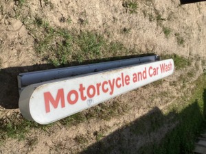 lot 77 image: Motorcycle and Car Wash sign