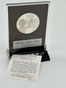 lot 205 image: Franklin Mint Miracle of Hanukkah Sterling Silver Medal