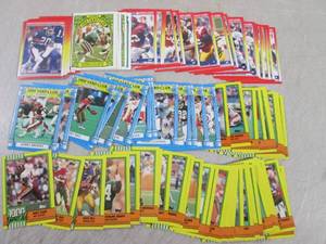 lot 106 image: (CNTR) 80 Star and Rookie Football...