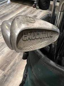 lot 153 image: Golfing Gear Lot Gold Caddy, Clubs, and Golf Balls