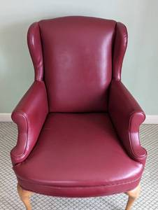 lot 97 image: Red Leather Armchair and Footstool