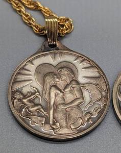lot 191 image: Pair of Hamilton Mint Sterling Silver Valentines Day Pendants