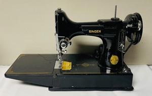 lot 306 image: Singer Portable Electric Sewing Machine with Case and Manual