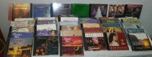 lot 22 image: Dozens Of CDs  Some Unopened. Mannheim Steamroller, Lori Line, Yanni, Tesch, Country, Rock, Classical  Big Variety