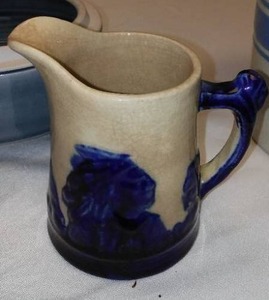 lot 139 image: Mammoth Antique 1900s Sleepy Eye pitcher creamer.