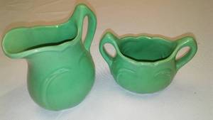 lot 155 image: Niloak Pottery - Creamer and Sugar in Green.
