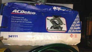 lot 195 image: Air Compressor, scissors Jack, Multimeters, outside vinyl covers and more
