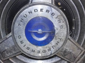lot 236 image: Ford Thunderbird Hub Caps and Ford Radio.