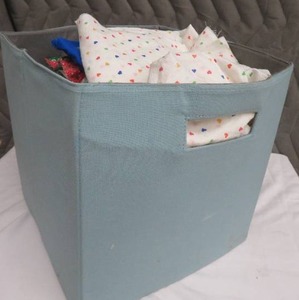 TOTE FULL OF FABRIC