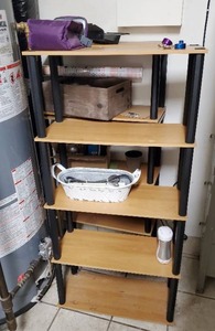 Two Shelving Units With Contents
