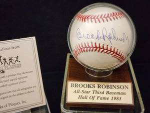 lot 23 image: Brooks Robinson Autographed Baseball with COA