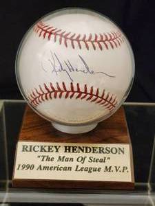 lot 74 image: Rickey Henderson Autographed Baseball with COA