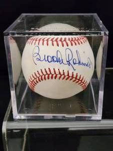 lot 107 image: Brooks Robinson Autographed Baseball with COA