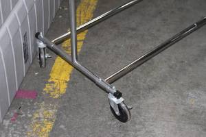 lot 52 image: Adjustable Rolling Garment  Clothes Rack with Curtain Holders