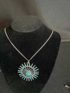 Silver Colored Necklace with Floral Pendant and Blue Crystals