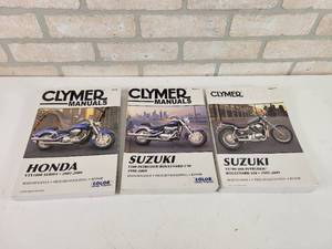 lot 609 image: (3) CLYMER Honda  Suzuki Motorcycle Manuals