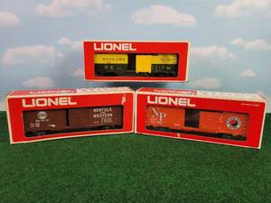 lot 361 image: (3) LIONEL O Scale Rail Cars - N&W Boxcar, Northern Pacific Boxcar & Rutland Boxcar