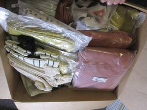 box of new decorative pillow covers...