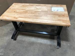 lot 12 image: Husky 62 in. W x 24 in. D Adjustable Height Solid Wood Top Workbench Table in Black
