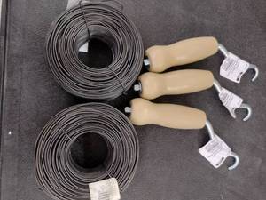 lot 215 image: Tie Wire and twisters (3). 330 ft per roll (2).