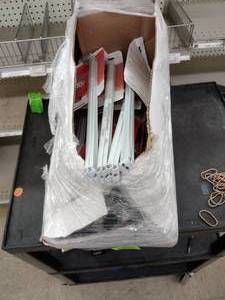 lot 221 image: Closet Maid 12in. Support (16) each pkg has 2 supports.