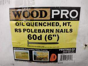 lot 330 image: Wood pro Pole Barn Nails, 60D, 6 in. Approx half full. about 25 pounds