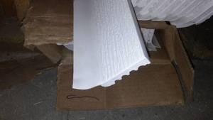 lot 600 image: White Stop Garage Trim (24) ea. 16 ft. L