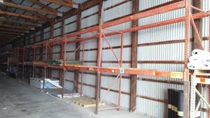 lot 705 image: 8 Orange Sections Of Racking Plus 1 Tan. Each Section Is 9-Foot X 42 Inch Loc BB