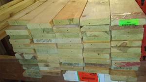 lot 720 image: 1x4x 16ft Green Treated  (65) Nearly $950 Lot