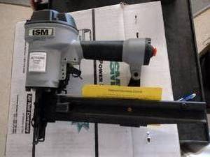 lot 823 image: ISM Air Nailer. Model MC716200.