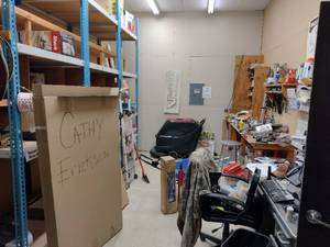 lot 833 image: Contents of Room. does not include floor scrubber or blue racking