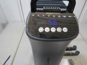 lot 35 image: Amazon Basics Portable Digital Radiator Heater with 7 Wavy Fins and Remote Control, Black, 1500W