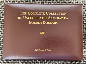 lot 17 image: Sacagawea Uncirculated Dollars and Book