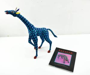 lot 129 image: Armando Jimenez Wood Carved and Painted Giraffe Sculpture and Oaxacan Wood Carving Book
