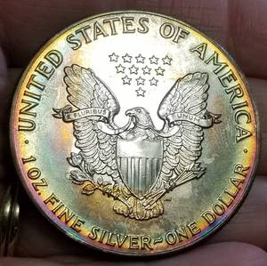 1986 AMERICAN SILVER EAGLE WITH AMAZING TONING
