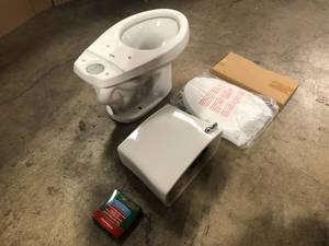 lot 14 image: Penguin Toilets 2-pc. 1.28 GPF Single Flush Elongated Toilet with Patented Overflow Protection Technology in White with Seat