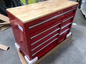 lot 28 image: Husky 42 in. W x 18.1 in. D 8-Drawer Red Mobile Workbench Cabinet with Solid Wood Top