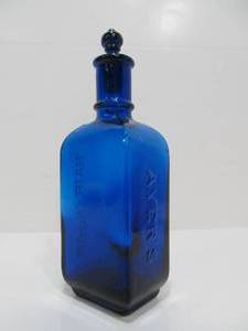 lot 40 image: Antique Cobalt Blue Embossed Glass AYERS Hair Vigor Bottle 